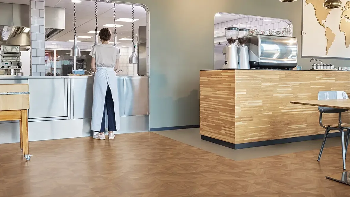 Forbo Surestep Wood safety vinyl in a hospitality kitchen and service area